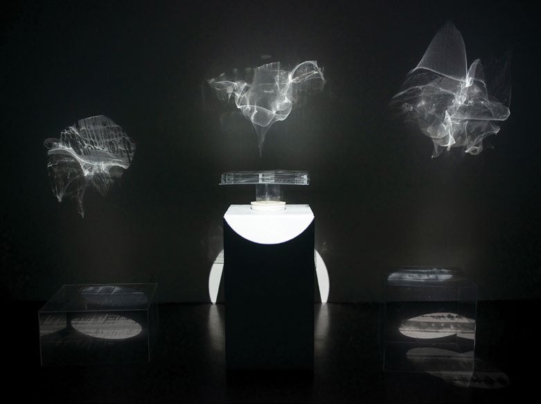 Kate Montgomery, Rince Fada (Long Dance), 2024. Installation image of a projected art, very dark, black and white.